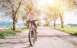 woman riding a bike on a beautiful spring day